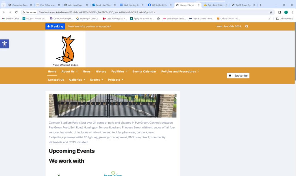 The Friends of Cannock Stadium website's home page. The logo is a fox sitting down, looking at the sky, the main image is of a set of black and gold gates. 